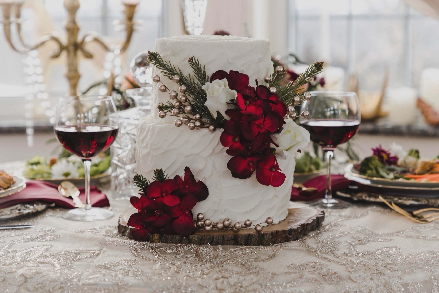 Wedding cake with red floral accents