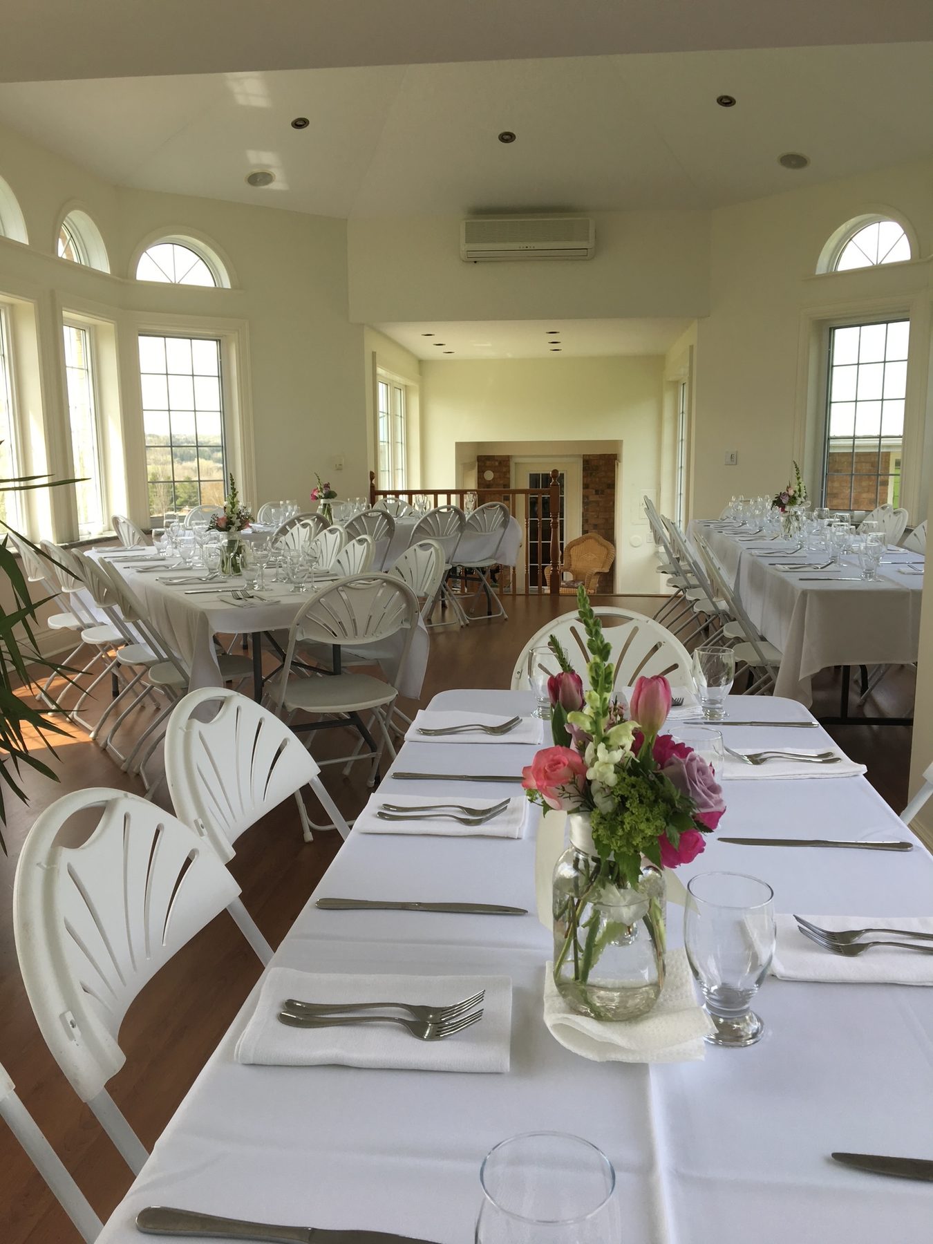 Atrium reception — guests seated, full room view